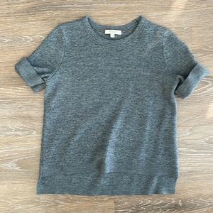 Thick cotton grey short sleeve with cuffed sleeves. High low detail